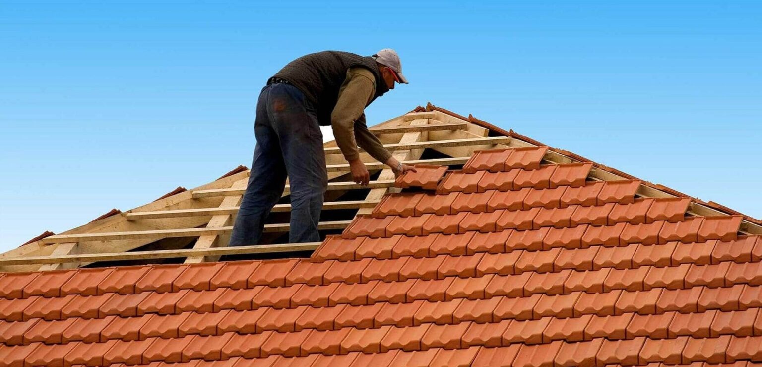 A roofing expert during roof installation in a residential house